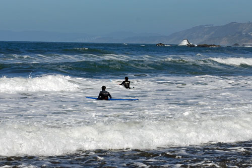 surfers at Linda Mar Beach, Pacifica, CA
