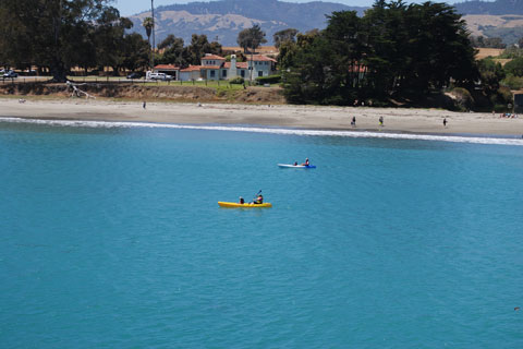 kayakers at William R. Hearst Memorial State Beach, San Luis Obispo County, CA