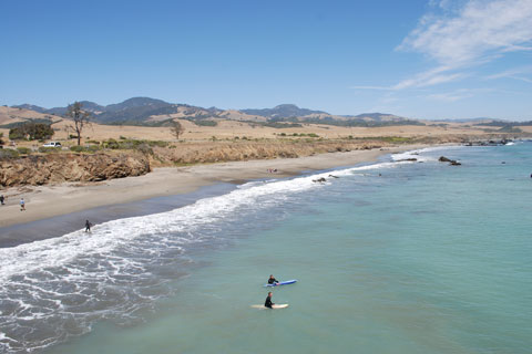 surfers at William R. Hearst Memorial State Beach, San Luis Obispo County, CA