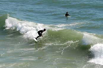 surfing at Pismo Beach, San Luis Obispo County, CA